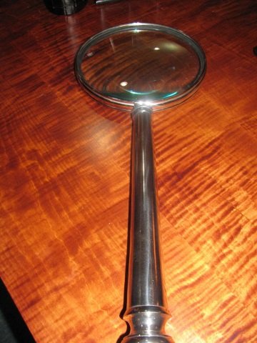 Oversized Magnifier: Chrome handle. 22" long. Glass. 8 1/2" diameter. Perfect for the amateur sleuth.