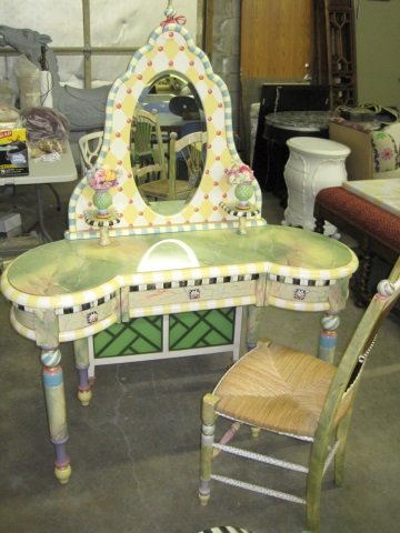 MacKenzie-Childs Garden Awning Vanity: No Longer in Production. Handcrafted of gmelina and terra cotta and features harlequin diamond details, faux marble finishes, hand-made ceramic knobs, a ceramic and silk tassel, and thistle vases on e