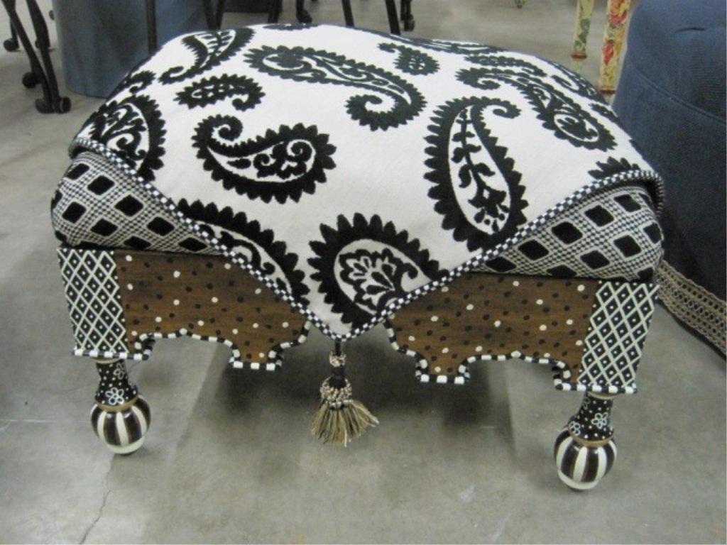 MacKenzie-Childs Black & White Ottoman: No Longer in Production. Cushion upholstered with sculpted black velvet on linen, trimmed with black and white checked cording and tassel accents. 23" wide x 18" long x 15" tall. $2,000.