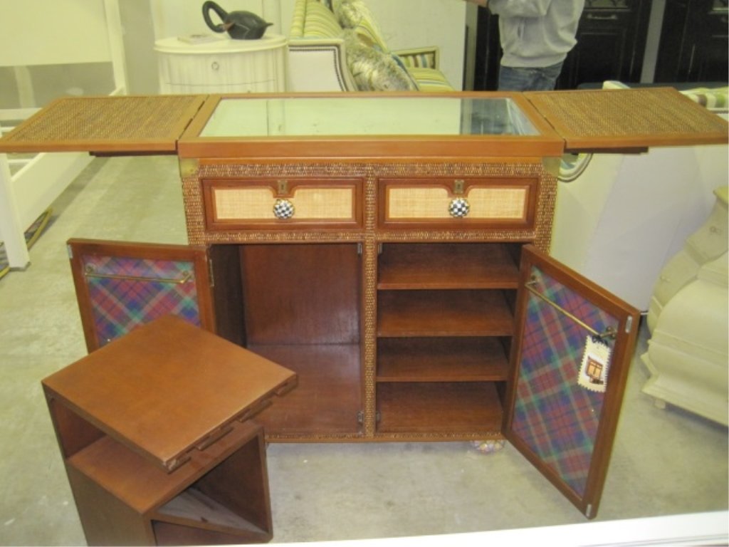 MacKenzie-Childs Courtly Campaign Bar Cabinet: Leather accented courtly checked enamelled top opens to reveal a beveled mirror work surface, removable wine rack, tracks for stemware, adjustable shelves, hand towel rods, and custom colored MacKenzi