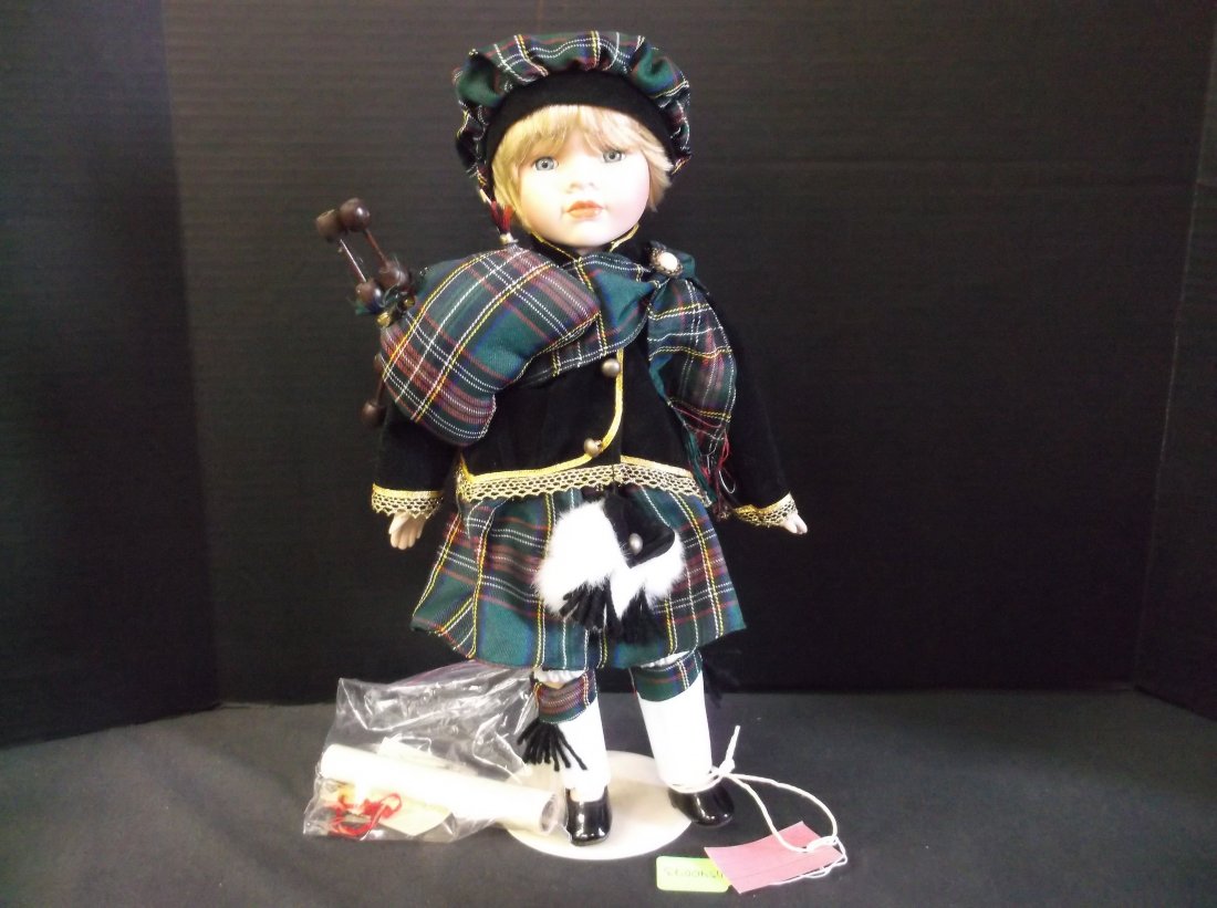 "Hamish" - by Magaret Elliott. Made by The House of: "Hamish" - by Magaret Elliott. Made by The House of Valentina in 1999. Made in Britain. Doll, legs are jointed, soft body, dressed in plaid hat and klimt. Trimmed in gold lace and inlet eyes. Has with