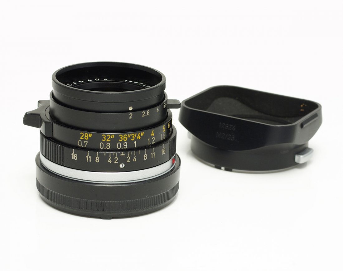 Leica M Summicron 2/35 mm Black Canada: No front cap. With hood. Condition: B Estimates: 550 - 1200 EUR