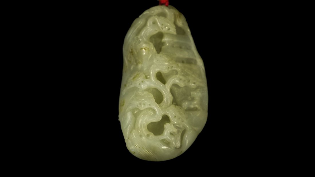 HETIAN CYAN WHITE JADE WITH RED SKIN PENDANT: Fine Chinese cyan jade carved ellipse pendant, featuring pine tree design on front and archaic designs on top and botton portion. weight=189g (recommended by our expert).和田青௙