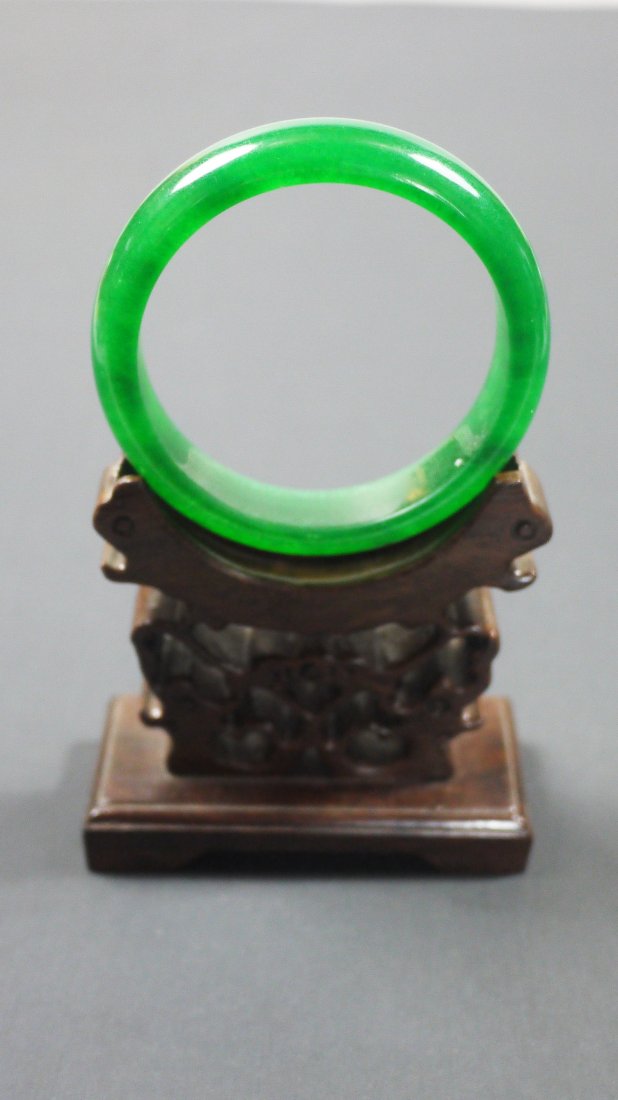 Jade Bracelet: （Jade Bracelet)Colour: green Size: 6 cm diameter Weight: 56g. the bracelet is green colour stone,the bangle with sides undercorated and soft polish. （玉手镯） 