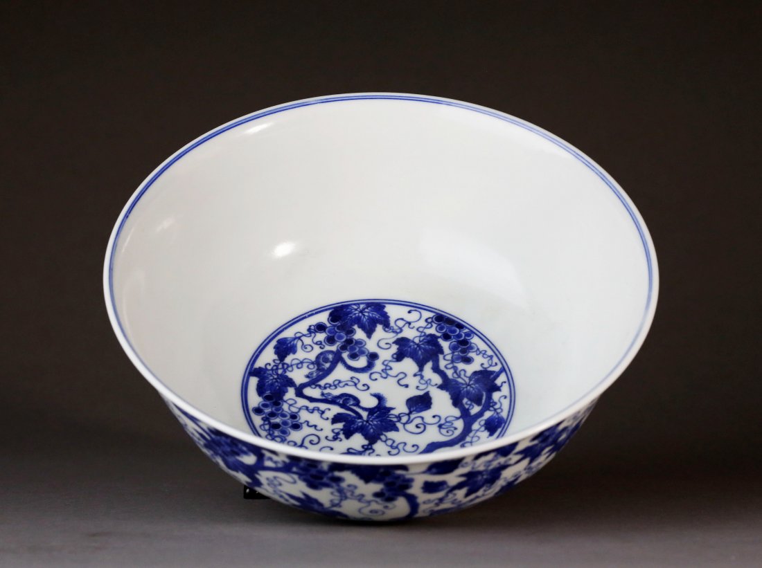 Blue & White Glaze Grape Pattern Bowl: 青花松鼠葡萄藤纹碗。口沿微撇，深腹，圈足，器形饱满