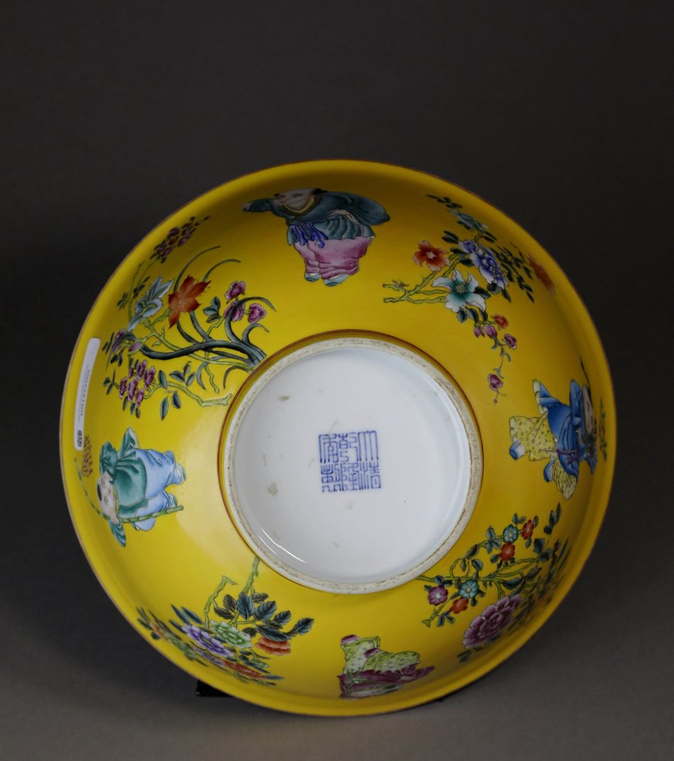 Famille Rose Figure and Flower Pattern Bowl: 黄地粉彩婴戏花卉纹碗。此碗器型规整，釉面洁润，胎体