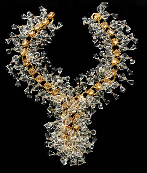 Wm de Lillo Exotic Jabot Necklace: Wm de Lillo Exotic Jabot Necklace Designed by Robert F. Clark, American, 1971 A multitude of 300 faceted 18 mm lucite dangling beads and drops mounted on a constructed chain of decorative brass rings