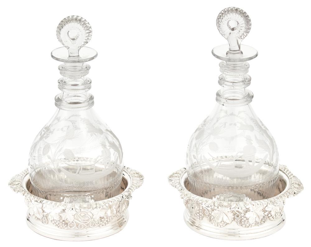 Pair of Georgian Etched Glass Decanters and Pair of: Pair of Georgian Etched Glass Decanters and Pair of Regency Style Silver Plated Wine Coasters The bottles etched with farmer and plow with ring neck, the coasters with shell and gadroon rim, the body