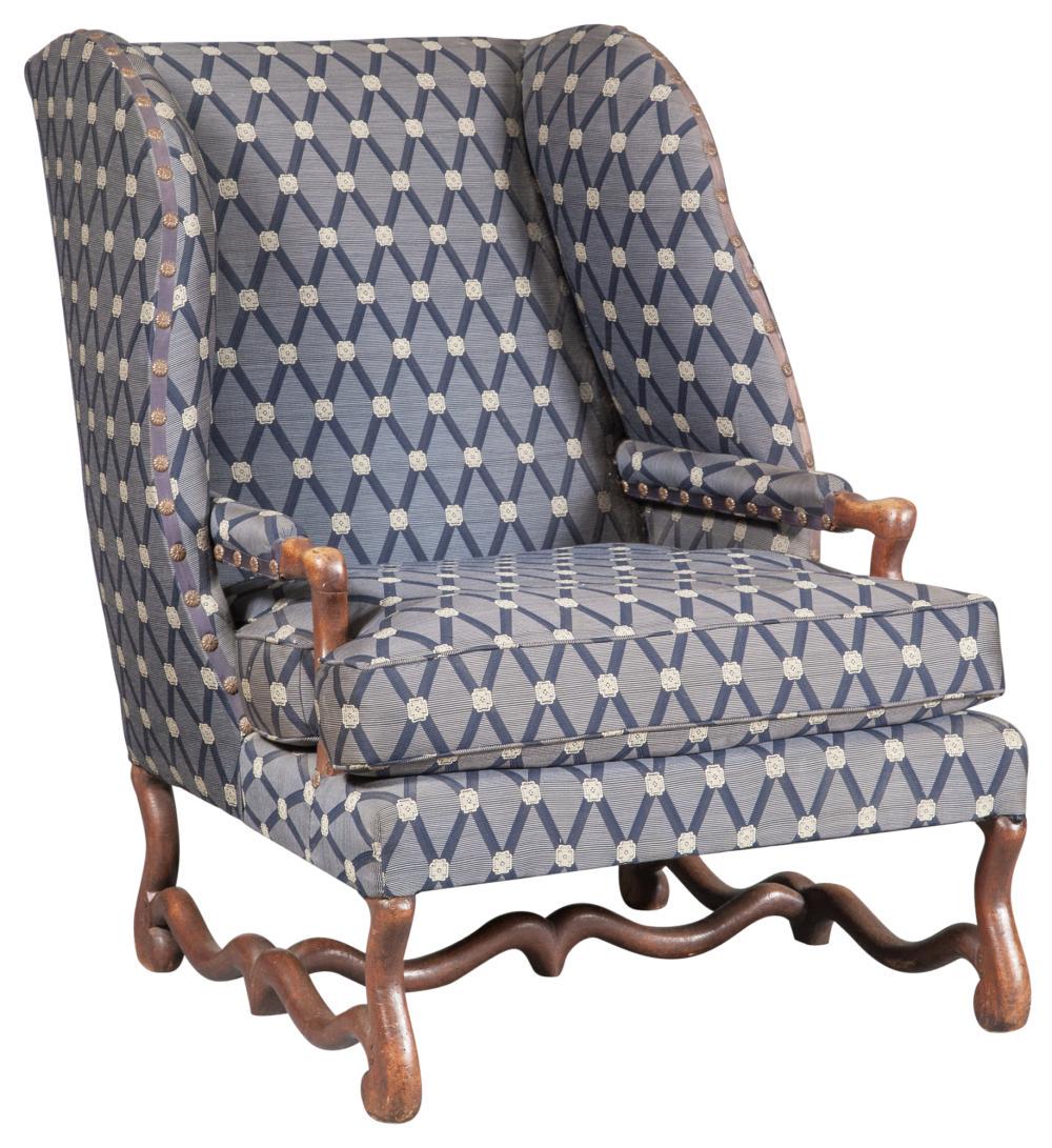Louis XIV Style Stained Beechwood Bergère à: Louis XIV Style Stained Beechwood Bergère à Oreilles Partially composed of older elements The padded back, arms and loose-cushioned seat raised on scrolled legs joined by stretchers. Height 