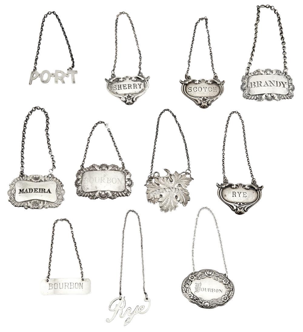 Group of Silver Bottle Tickets: Group of Silver Bottle Tickets 19th/20th Century Including Georgian and Victorian examples. Approximately eleven pieces. Total approximately 4 ounces. C