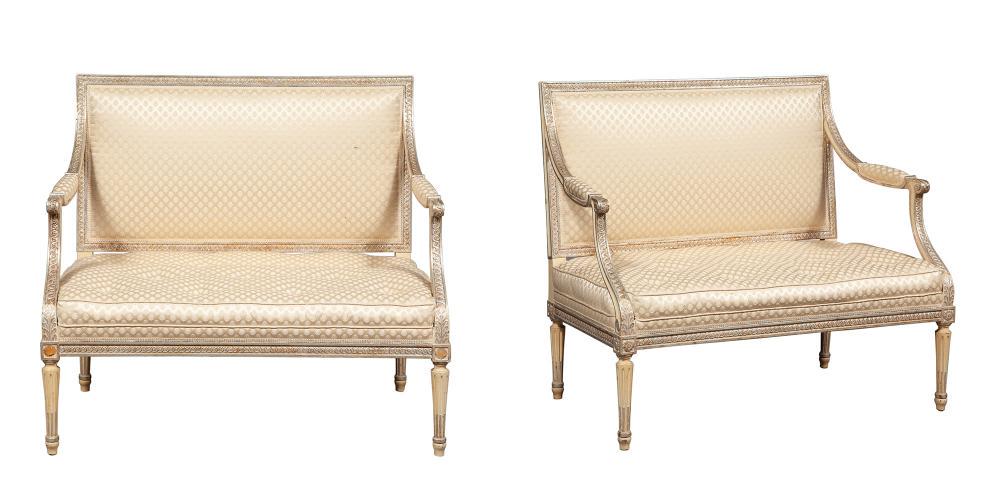 Pair of Louis XVI Style Painted and Part-Silvered Small: Pair of Louis XVI Style Painted and Part-Silvered Small Settees Height 34 inches, width 39 inches, depth 22 inches. C