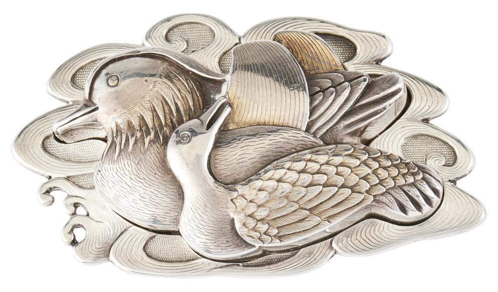 A Japanese Silver Water Dropper: A Japanese Silver Water Dropper Meiji Period Created in the form of two ducks on the water; with well-fit conforming base. Length 3 inches. C Property from an Esteemed New York Collection
