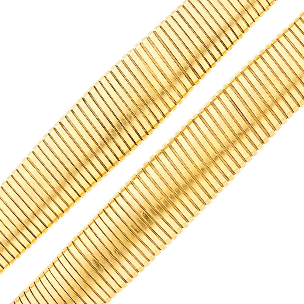 Pair of Gold Snake Link Bracelets: Pair of Gold Snake Link Bracelets 14 kt., ap. 84 dwts. Lengths 7 5/8 and 7 3/4 inches. C The Collection of Jane and John Gunther