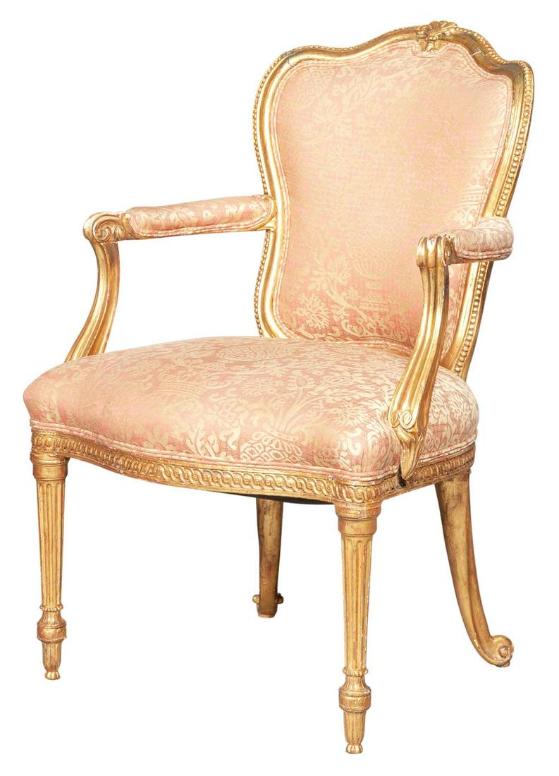 George III Giltwood Open Armchair: George III Giltwood Open Armchair Attributed to Thomas Chippendale Circa 1775 The padded cartouche-shaped backrest within a molded beaded frame surmounted by a palmette cresting, the overupholstered s