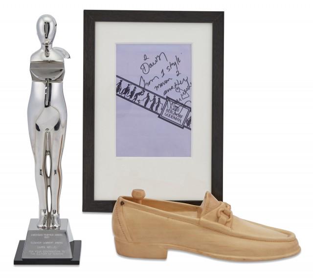 GUCCI A Carved Wood Gucci Loafer Presented to Dawn: GUCCI A Carved Wood Gucci Loafer Presented to Dawn Mello. Inscribed on the bottom Best Wishes in the "Big Apple" from the Gucci Shoe Dept., length 11 inches; Together with an Ernest Trova Designed Fas