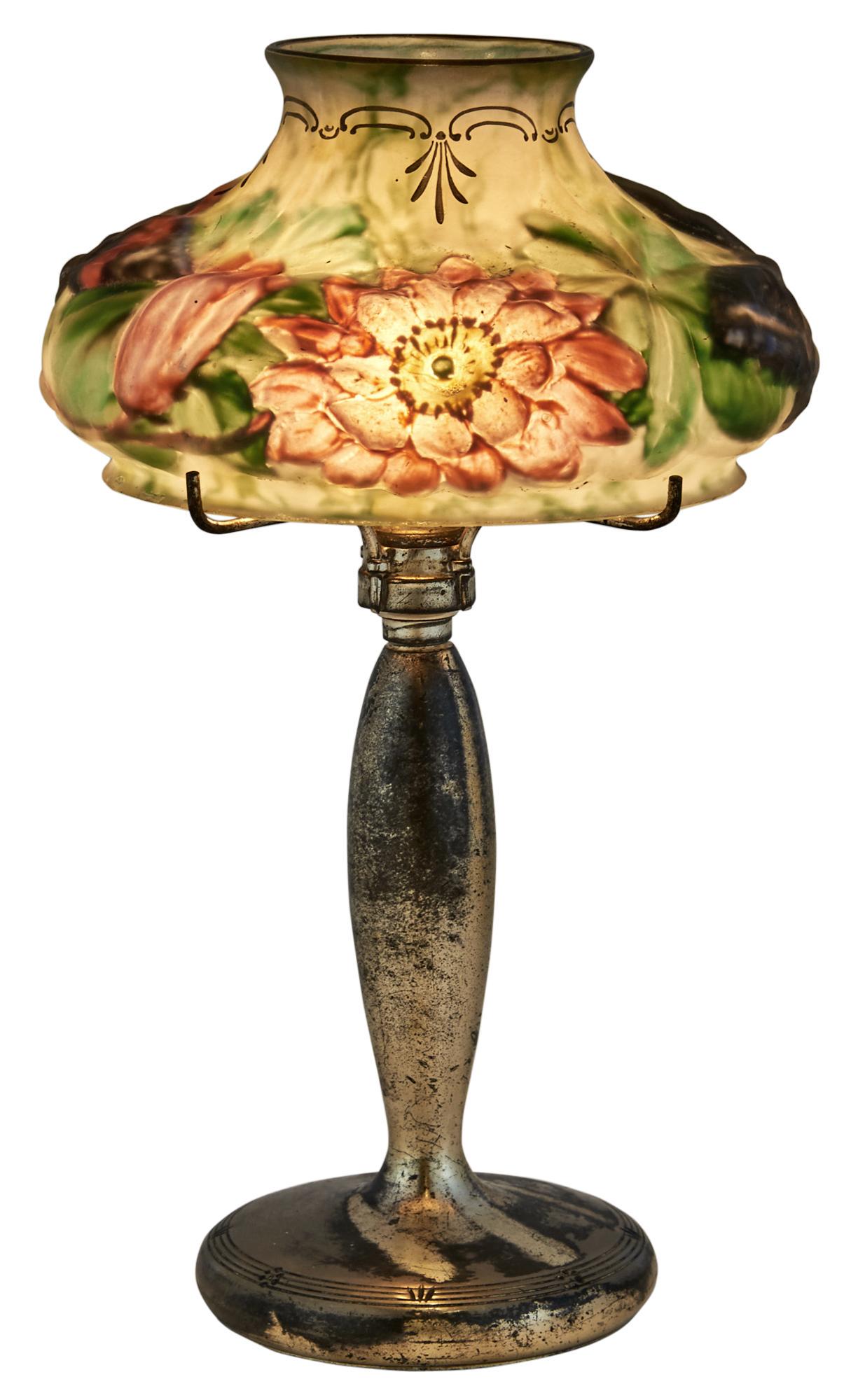 Pairpoint Mfg. Corporation Metal and Reverse-Painted: Pairpoint Mfg. Corporation Metal and Reverse-Painted Glass Puffy Boudoir LampCirca 1910Molded glass shade with butterfly and poppy design, on a silvered metal base, base marked with factory trademark 