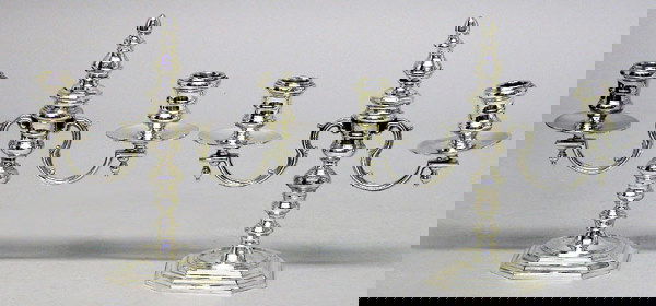 Pair of English Sterling Silver Two-Light Candela: Pair of English Sterling Silver Two-Light Candelabra Each of double baluster form, issuing two scrolled branches ending in bobeches and a wide drip pan, the center finial removable for conversion int
