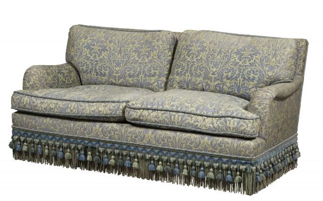 Upholstered and Fringed Love Seat: Upholstered and Fringed Love Seat Height 32 3/4 inches, width 63 1/2 inches, depth without back cushions 29 1/2 inches. C The Estate of a European Collector