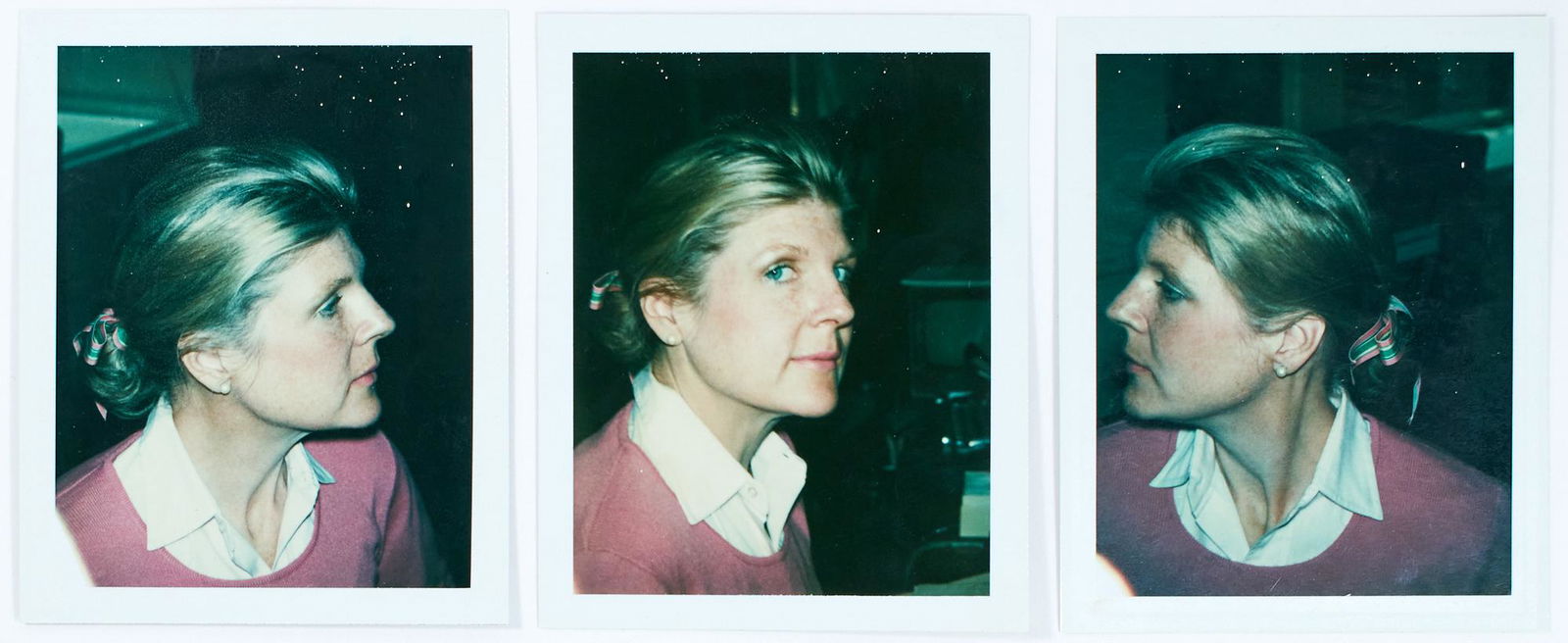BRIGID BERLIN Three self-portrait Polaroid photographs.: BRIGID BERLIN Three self-portrait Polaroid photographs. New York: circa 1981. Three Polacolor photographs, each a bust length portrait of Brigid Berlin wearing a white shirt and pink sweater with a ri