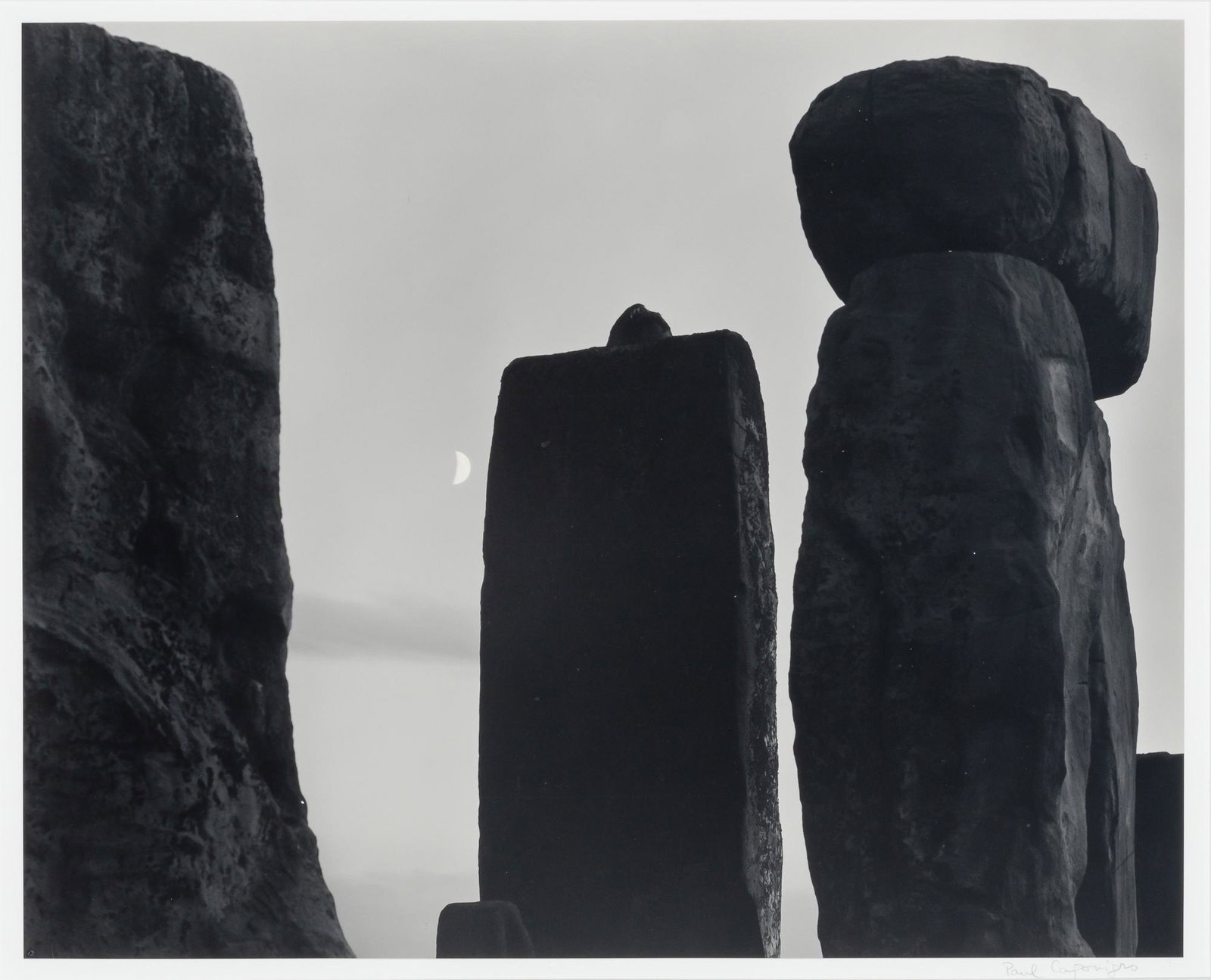 CAPONIGRO, PAUL (b. 1932) Untitled [Stonehenge, Half Moon], circa 1972, likely printed 1980s.: CAPONIGRO, PAUL (b. 1932) Untitled [Stonehenge, Half Moon], circa 1972, likely printed 1980s. Gelatin silver print, 15 1/8 x 18 1/2 inches (384 x 487 mm), dry mounted, signed on the mount in pencil lo