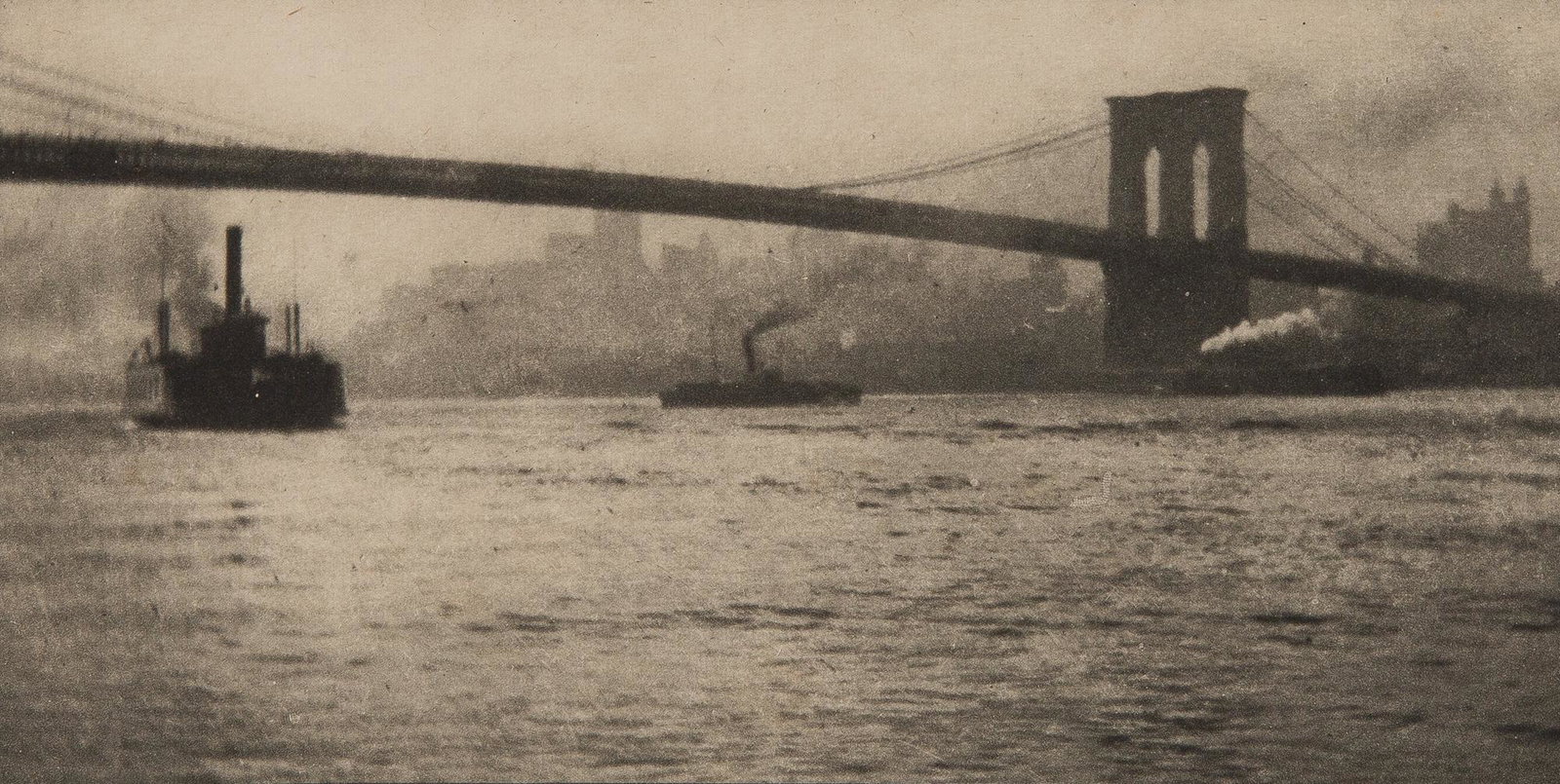 COBURN, ALVIN LANGDON (1882-1966) Two hand-pulled photogravures, tissue on card mounts,: COBURN, ALVIN LANGDON (1882-1966) Two hand-pulled photogravures, tissue on card mounts, for New York, 1913 (which, as published, contained a suite of twenty). Comprises Brooklyn Bridge from the River,