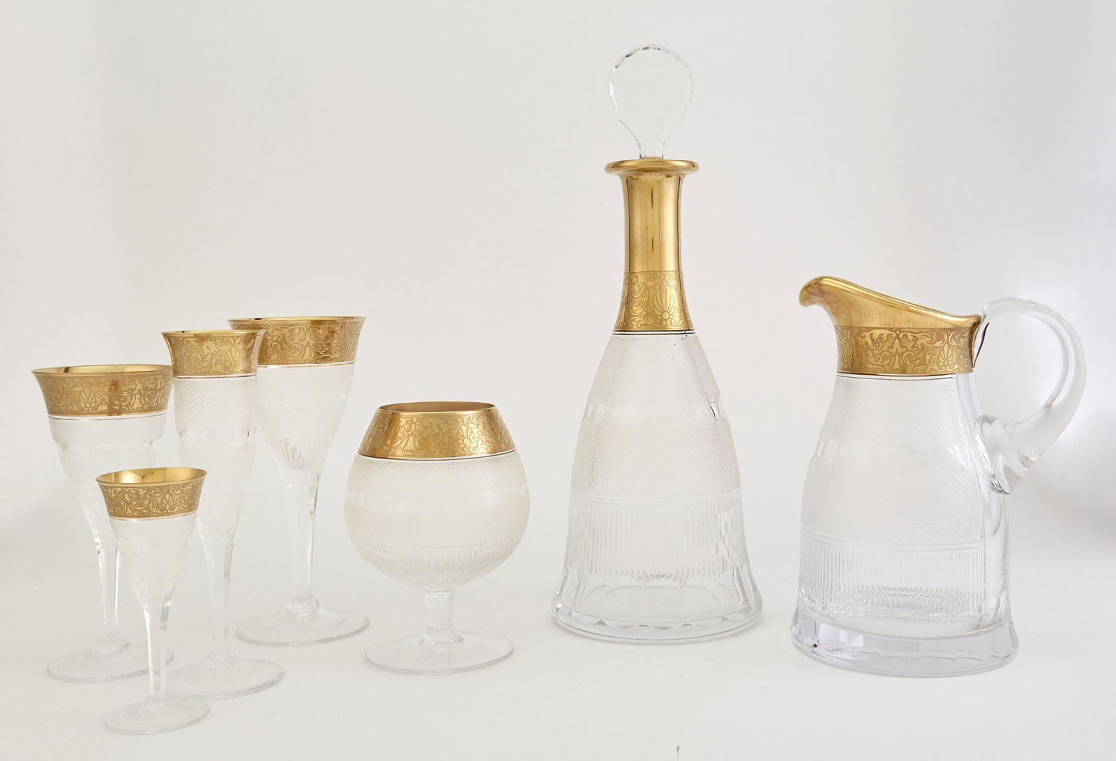 Moser Splendid Pattern Glass Stemware Service: Moser Splendid Pattern Glass Stemware Service Comprising eleven champagne flutes; six brandy glasses; twelve water goblets, height 8 inches; twelve wine glasses, height 6 3/4 inches; nine tumblers, he