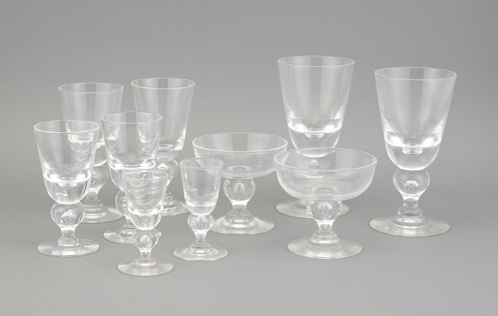 Group of Steuben Teardrop Glasses: Group of Steuben Teardrop Glasses Comprising twenty-four water goblets, height 6 3/4 inches; twenty-four wine glasses, height 5 3/4 inches; twenty-four port glasses, height 5 1/4 inches; twenty-four c