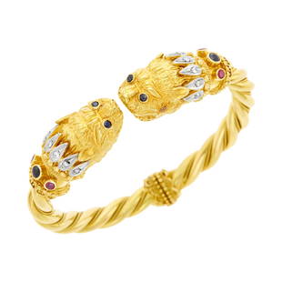 Ilias Lalaounis Two-Color Gold, Gem-Set and Diamond Chimera Bangle Bracelet: Ilias Lalaounis Two-Color Gold, Gem-Set and Diamond Chimera Bangle Bracelet 18 kt. yellow and white gold, 2 collet-set round sapphires and 4 round rubies, 12 small round diamonds, 4 collet-set round s