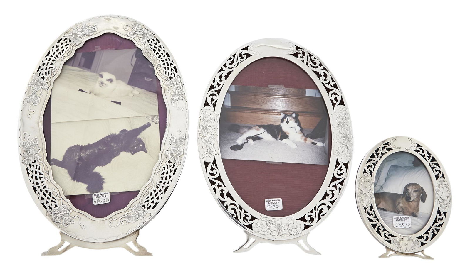 Three American Sterling Silver Picture Frames: Three American Sterling Silver Picture Frames I.N. Deitsch, 1920s Each oval with pierced scroll and floral engraved border. Height of largest 11 1/2 inches, width 7 3/4 inches; height of middle 10 inc