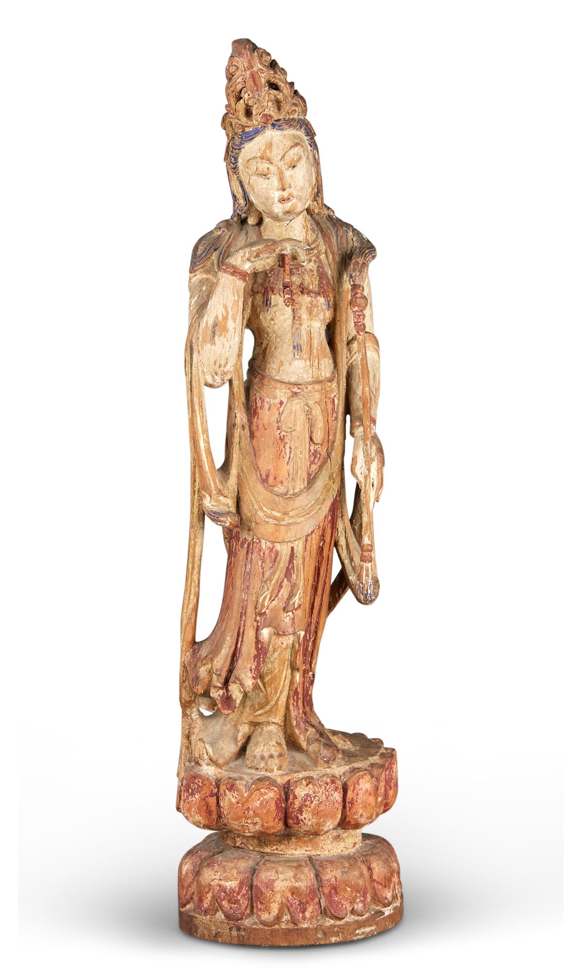 A Chinese Polychromed Wood Figure of Guanyin: A Chinese Polychromed Wood Figure of Guanyin Ming Dynasty The standing figure dressed in draping attire atop a double lotus base. Height 24 inches C