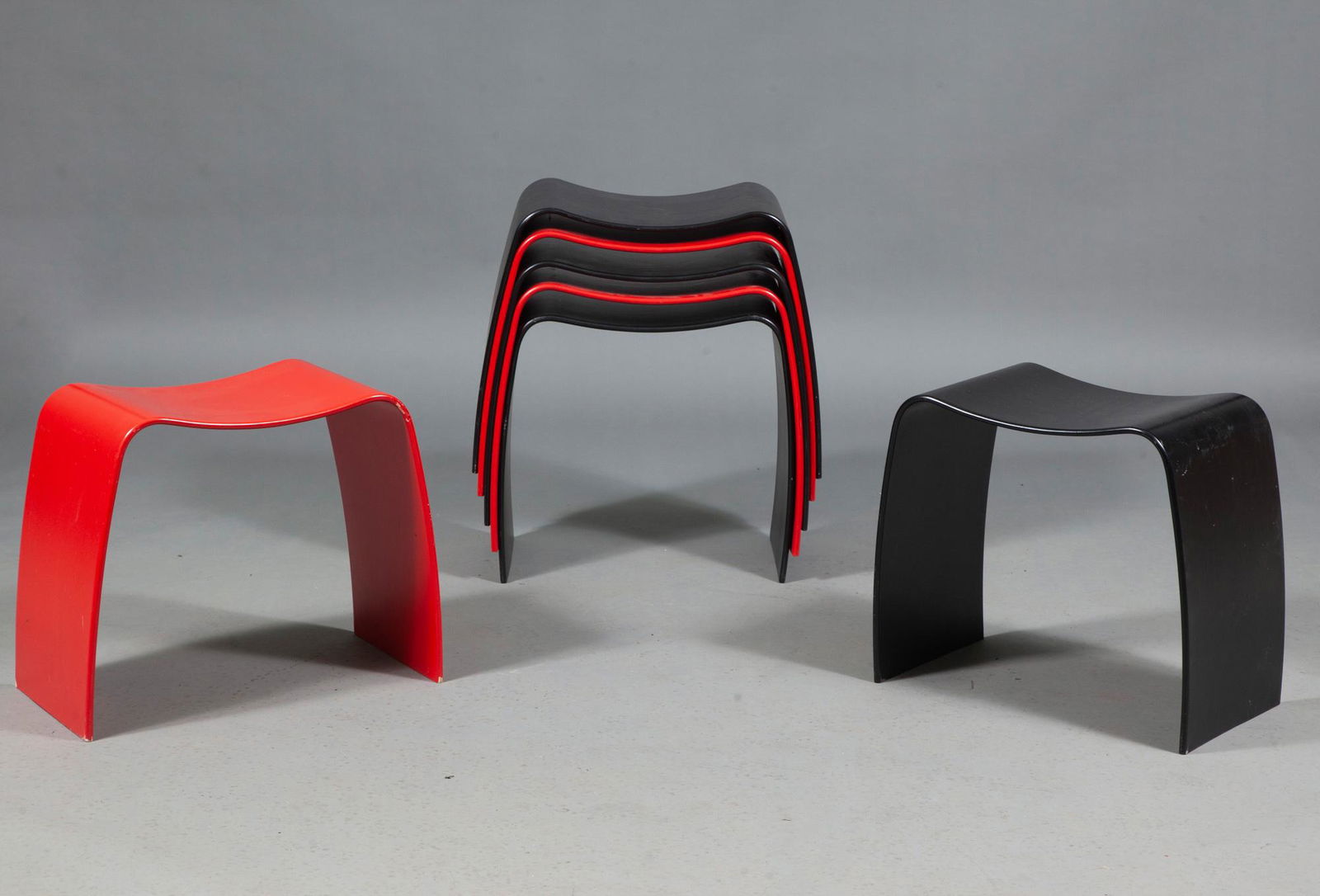 Group of Seven Danish Bentwood Askman Stools: Group of Seven Danish Bentwood Askman Stools Design Jørgen Møller, recent issue Comprising four black examples and three red examples. Height 18 inches, width 19 1/4 inches, depth 11 3/4 inc