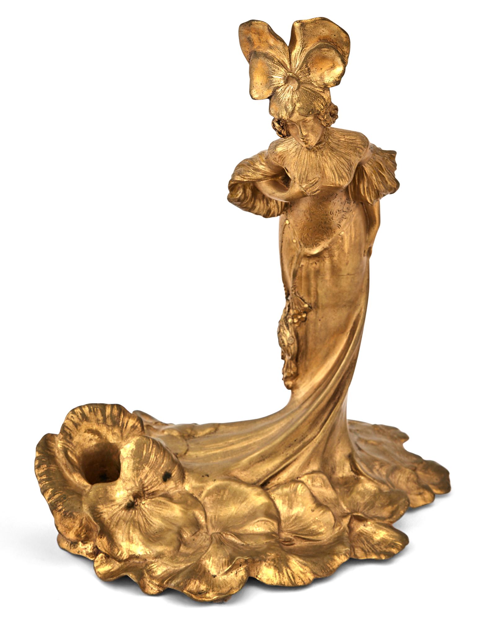French Art Nouveau Gilt-Bronze Figure of a Woman: French Art Nouveau Gilt-Bronze Figure of a Woman Cast from a model by Léo Laporte-Blairsy, circa 1900 Modeled in a bending forward pose, in a long dress swirled to her front, edged with oversize 