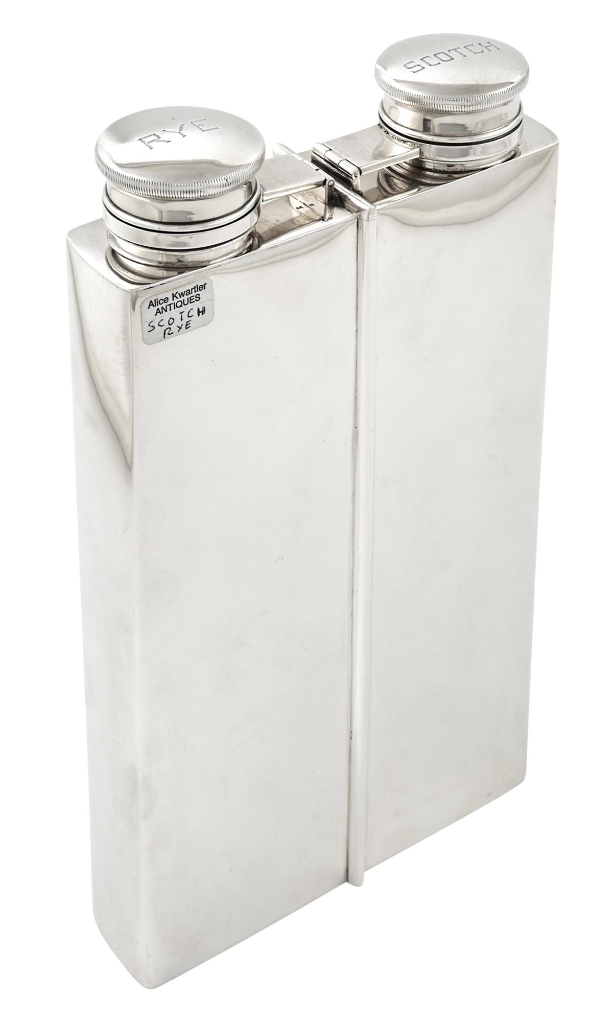 International Silver Co. Sterling Silver Double Flask: International Silver Co. Sterling Silver Double Flask 20th Century Rectangular, the covers engraved Scotch and Rye. Height 9 1/2 inches, approximately 24 ounces. C The Alice Kwartler Collection