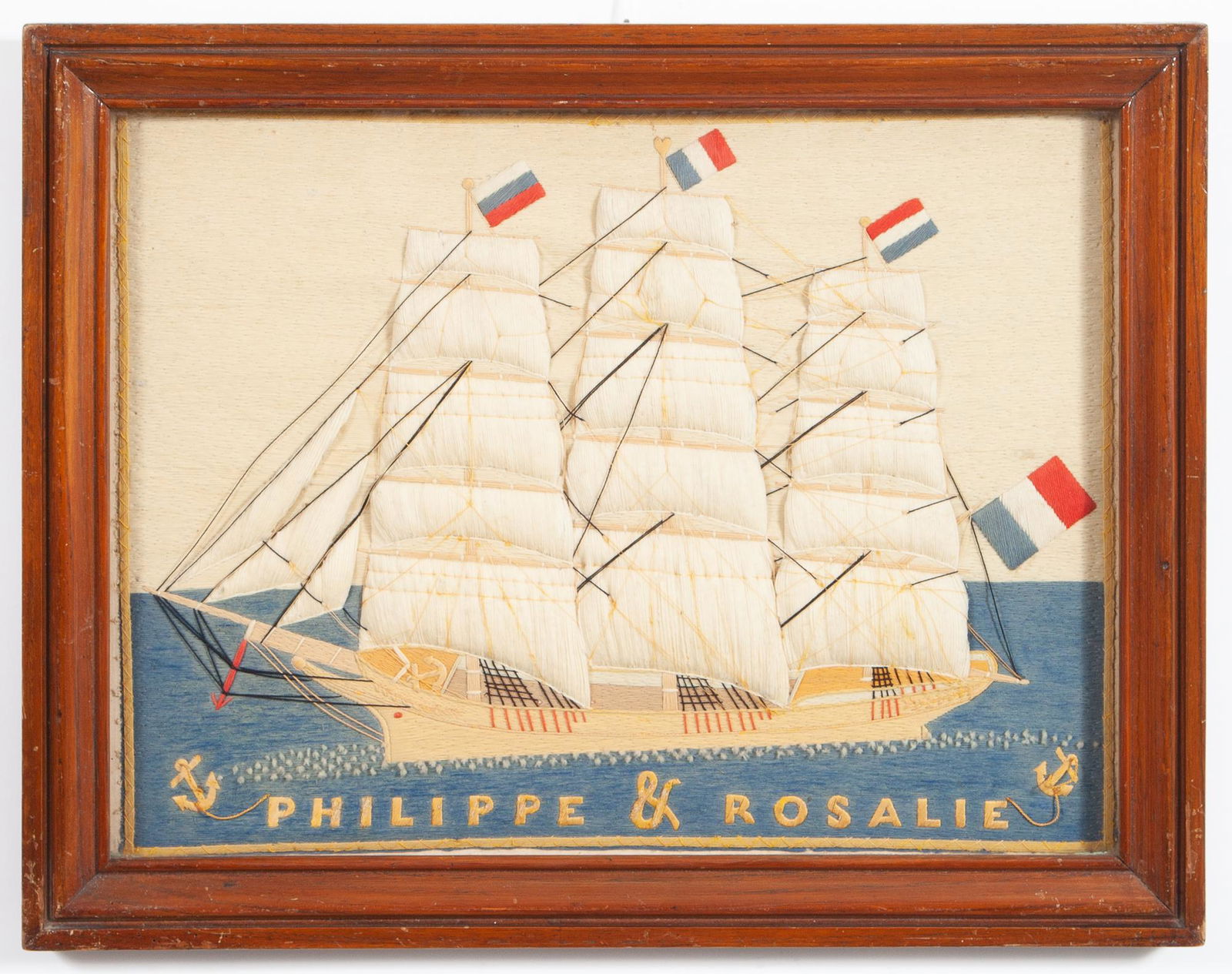 Woolwork Picture of a French Clipper Ship: Woolwork Picture of a French Clipper Ship 19th century Depicting the Philippe & Rosalie vessel surrounded by French flags with trapunto sails in a molded wood frame. Sight 16 1/2 x 23 inches. Provenan