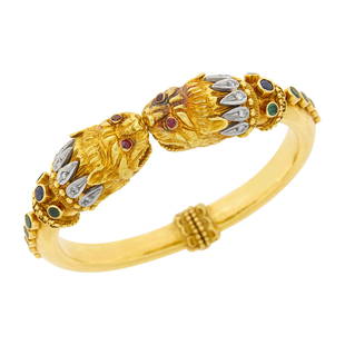 Ilias Lalaounis Two-Color Gold, Diamond and Gem-Set Chimera Bangle Bracelet: Ilias Lalaounis Two-Color Gold, Diamond and Gem-Set Chimera Bangle Bracelet 18 kt. yellow and white gold, 2 round sapphires and 14 round emeralds, small round ruby eyes, 12 small single-cut diamonds,