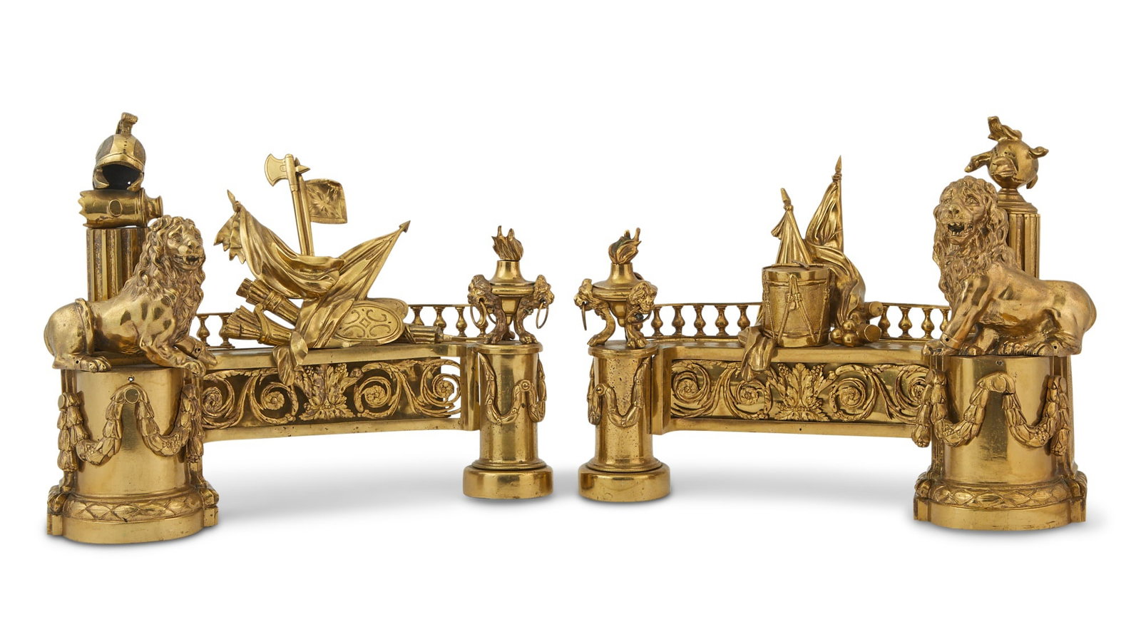 Pair of Louis XVI Style Gilt-Metal Chenets: Estate / Collection: Property from The Estate of Donald D. MacDermid Sold to Benefit TASIS The American School In Switzerland Each of truncated columnar pedestal form, surmounted with a recumbent lion