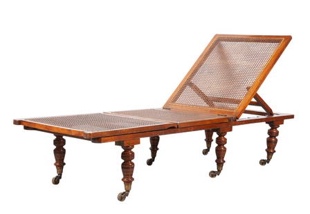 English Mahogany Adjustable Chaise Longue: Estate / Collection: Property from The Estate of Donald D. MacDermid Sold to Benefit TASIS The American School In Switzerland With an adjustable caned back and seat, raised on turned legs ending in br