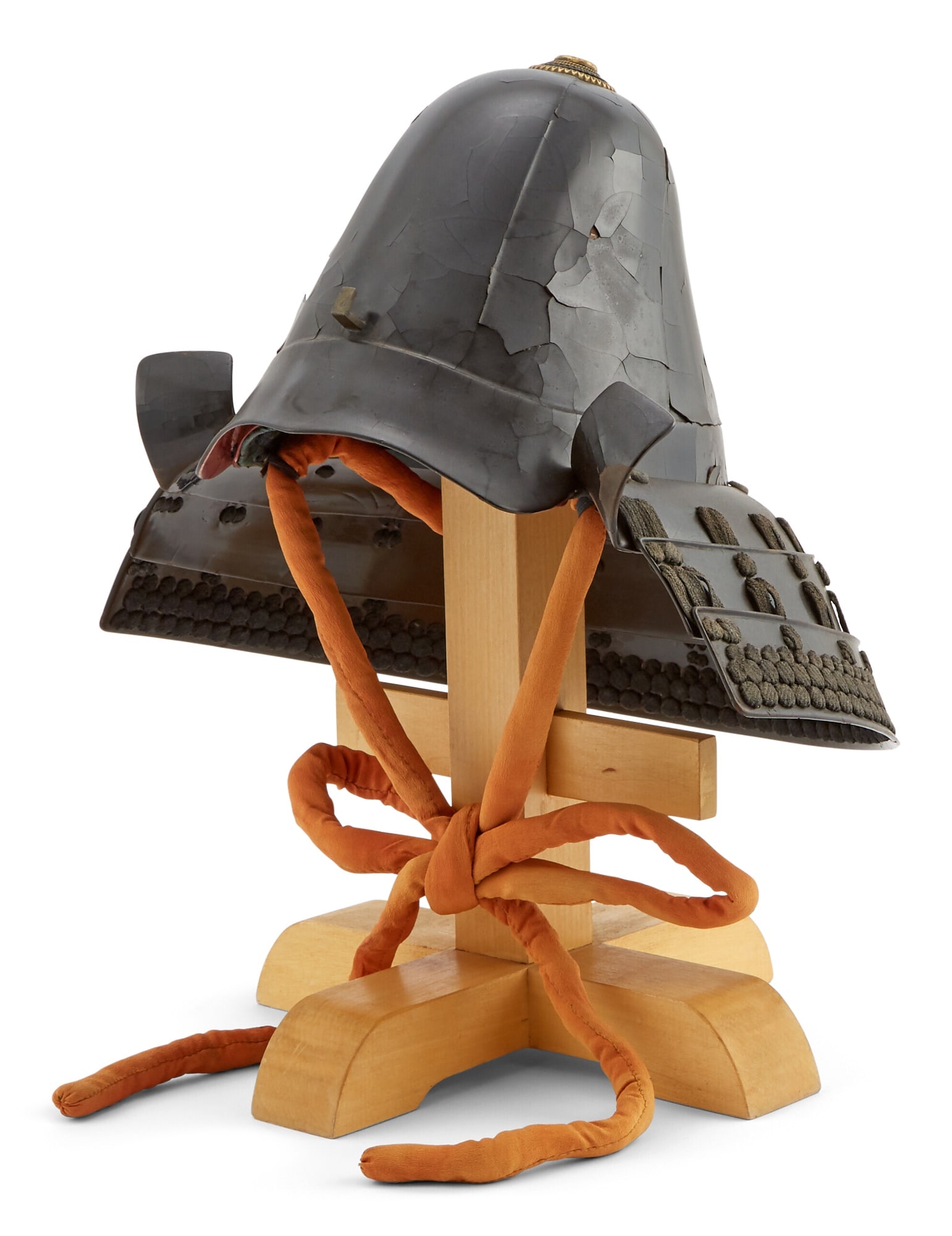 A Japanese Nanban Kabuto: Estate / Collection: Property from the Collection of Mary McFadden Of rounded and peaked form, with stand. Height 13 1/2 inches