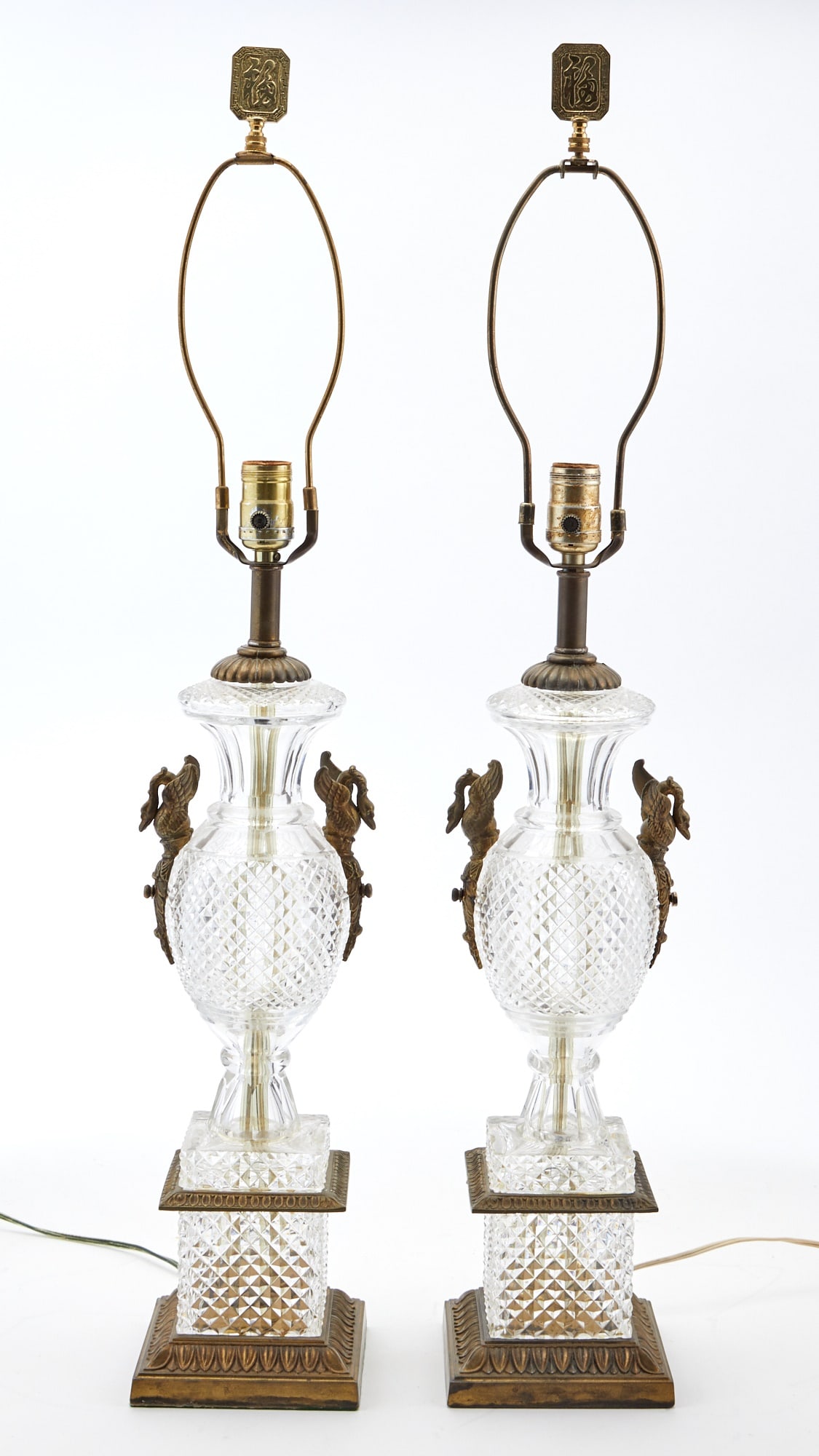 Pair of Empire Style Gilt-Metal Mounted Molded Glass Lamps with Swan Mounts: Height 18 inches.