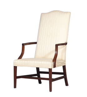 Federal Mahogany Lolling Chair: Massachusetts, circa 1795 The serpentine crest above shaped arms and concave supports, all on molded square tapering legs. Height 48 1/2 inches, width 27 inches, depth 29 1/4 inches, seat height 16 3/