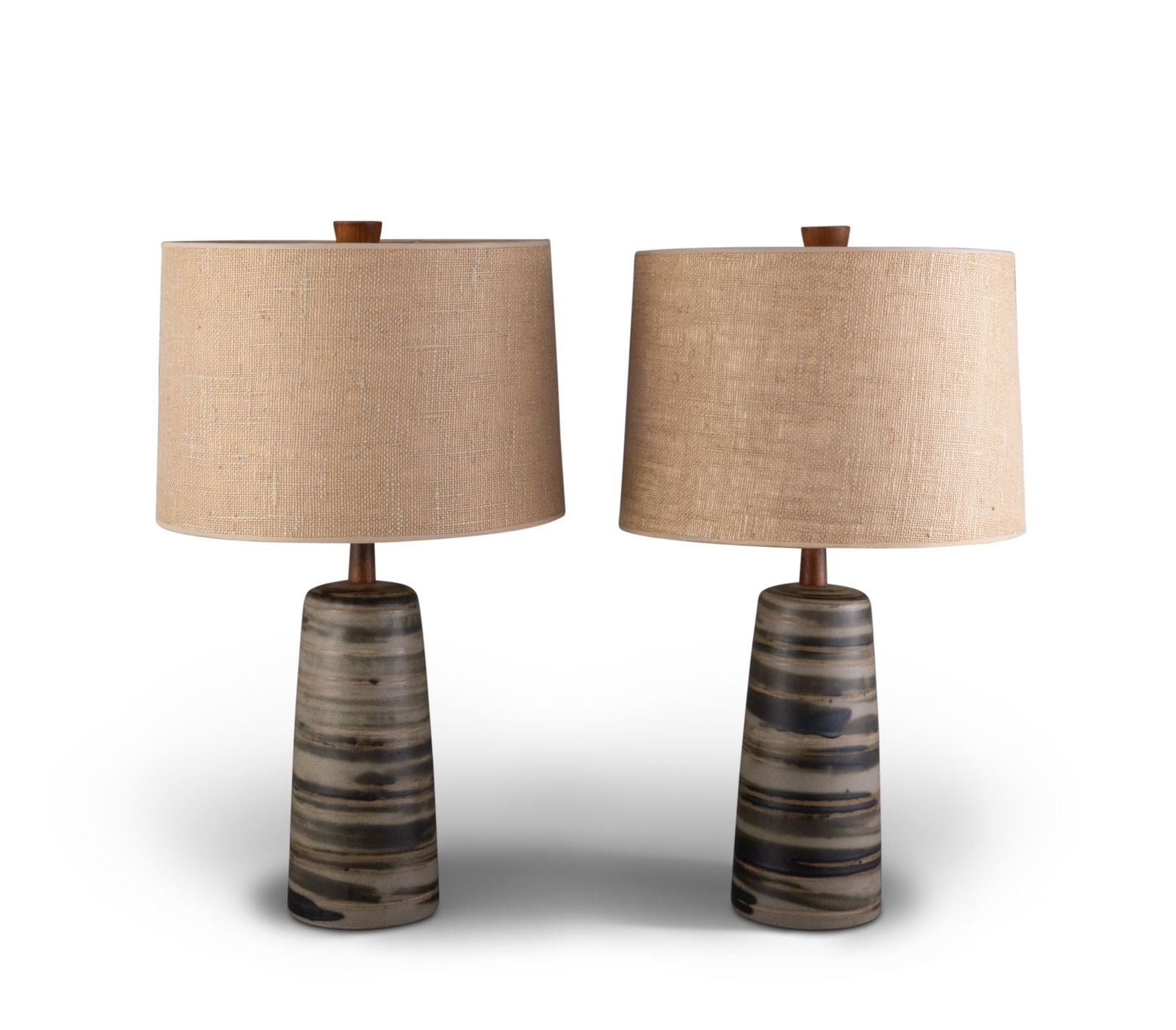 Pair of Gordon and Jane Martz Glazed Pottery Lamps: Circa 1965 Each with original shades and walnut finials, signed Martz. Height overall 24 inches.
