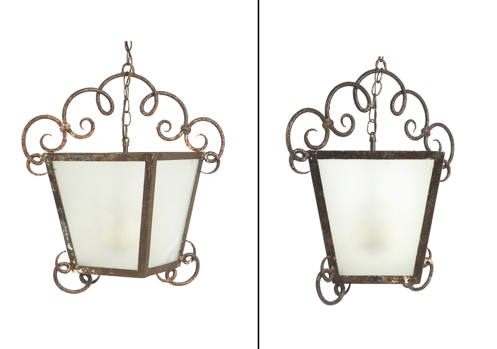 Pair of French Wrought Iron Lanterns: Each tapering square with extended scrolls to frame. Height 22 inches, width 21 inches, depth 17 inches.