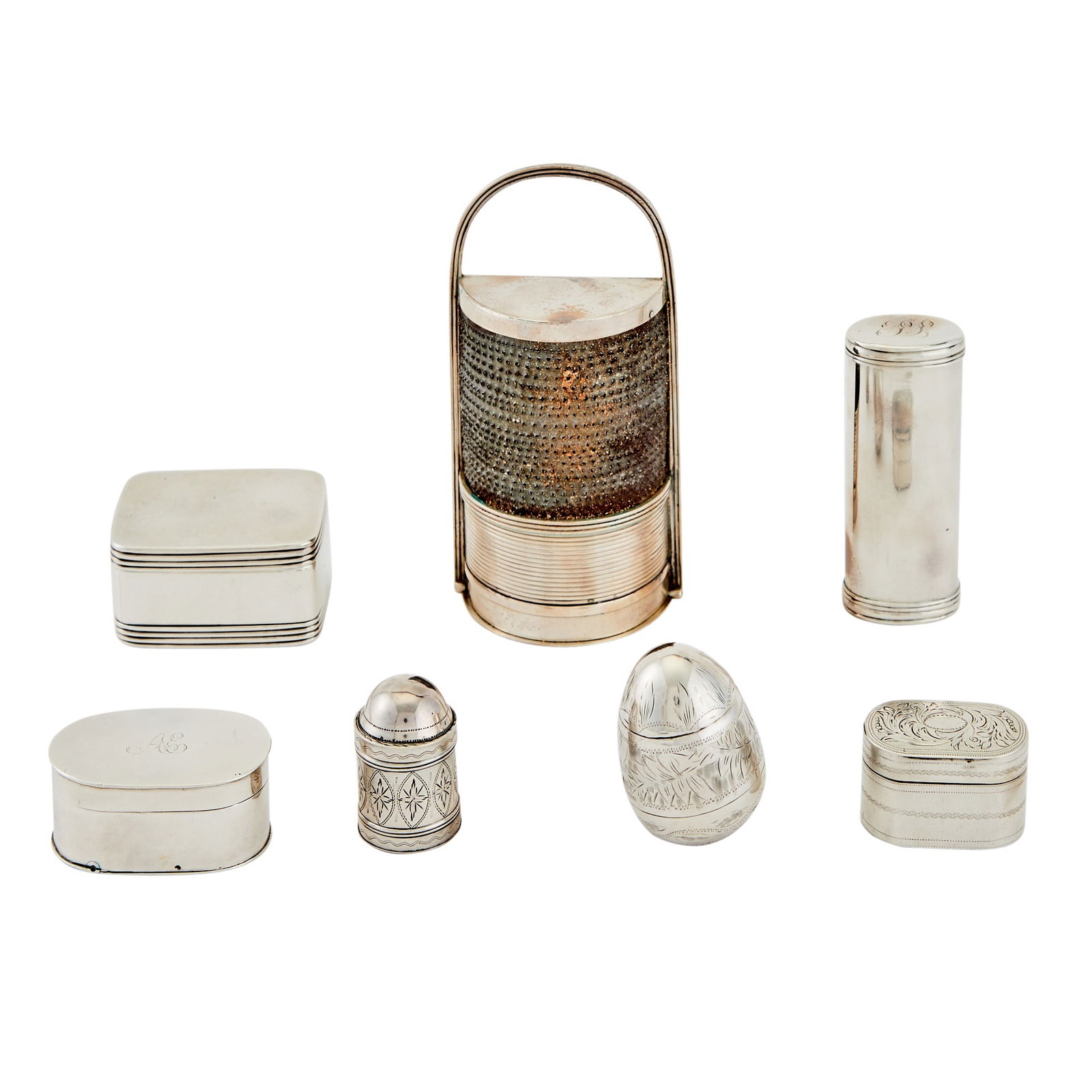 Group of Seven Georgian and Victorian Sterling Silver Nutmeg Graters Late 18th/ 19th century,: Comprising: Oblong example marked Edward Edwards, London, 1842, length 2 3/4 inches (7 cm). Egg-form double grater example apparently unmarked, late 18th century/ early 19th century, length 1 1/2 inch