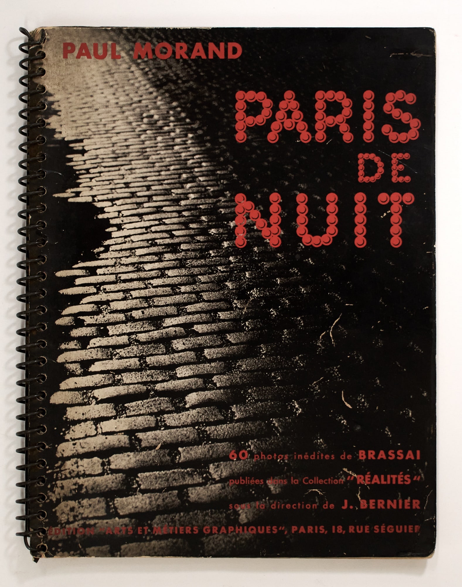 Brassai's classic illustrations of nighttime Paris: Estate / Collection: Property from the Collection of Rosa and Aaron Esman MORAND, PAUL and BRASSAÏ Paris de nuit. Paris: Editions "Arts et Métiers Graphiques," n.d. (1933). Spiral-bound pic
