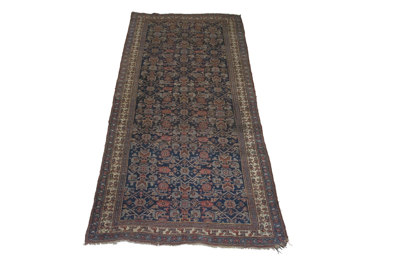 Bidjar Rug: North Persia, Late 19th Century The allover polychrome Herati pattern on the indigo field is within an ivory boteh border. Wool foundation. 9' 11" x 4' 5"