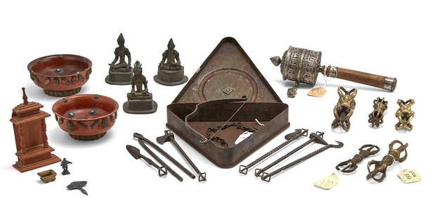 A Group of Himalayan Artifacts 19th century and earlier: Comprising Three Bronze Vajra, A North Indian Bronze Base, an Indian Bronze figure of Ganesha, A Tibetan Triangular Box and Ritual Contents, Two Japanese Vajra, a Tibetan Prayer Wheel, and Two Tibetan
