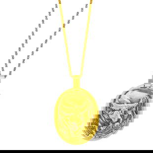 Cartier Paris Gold 'Taurus' Pendant with Gold Chain Necklace: Estate / Collection: The Estate of Gloria Naftali 18 and 14 kt., pendant signed Cartier, Paris, no. 60055, 43012, with French export mark, chain unsigned, ap. 9.8 dwts. Length 18 1/4 inches.
