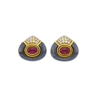 Bulgari Pair of Gold, Hematite, Cabochon Ruby and Diamond Earclips: Estate / Collection: From the Private Collection of an American Philanthropist18 kt., 2 oval cabochon rubies, 32 round diamonds ap. 1.10 cts., signed Bulgari, ap. 14 dwts.