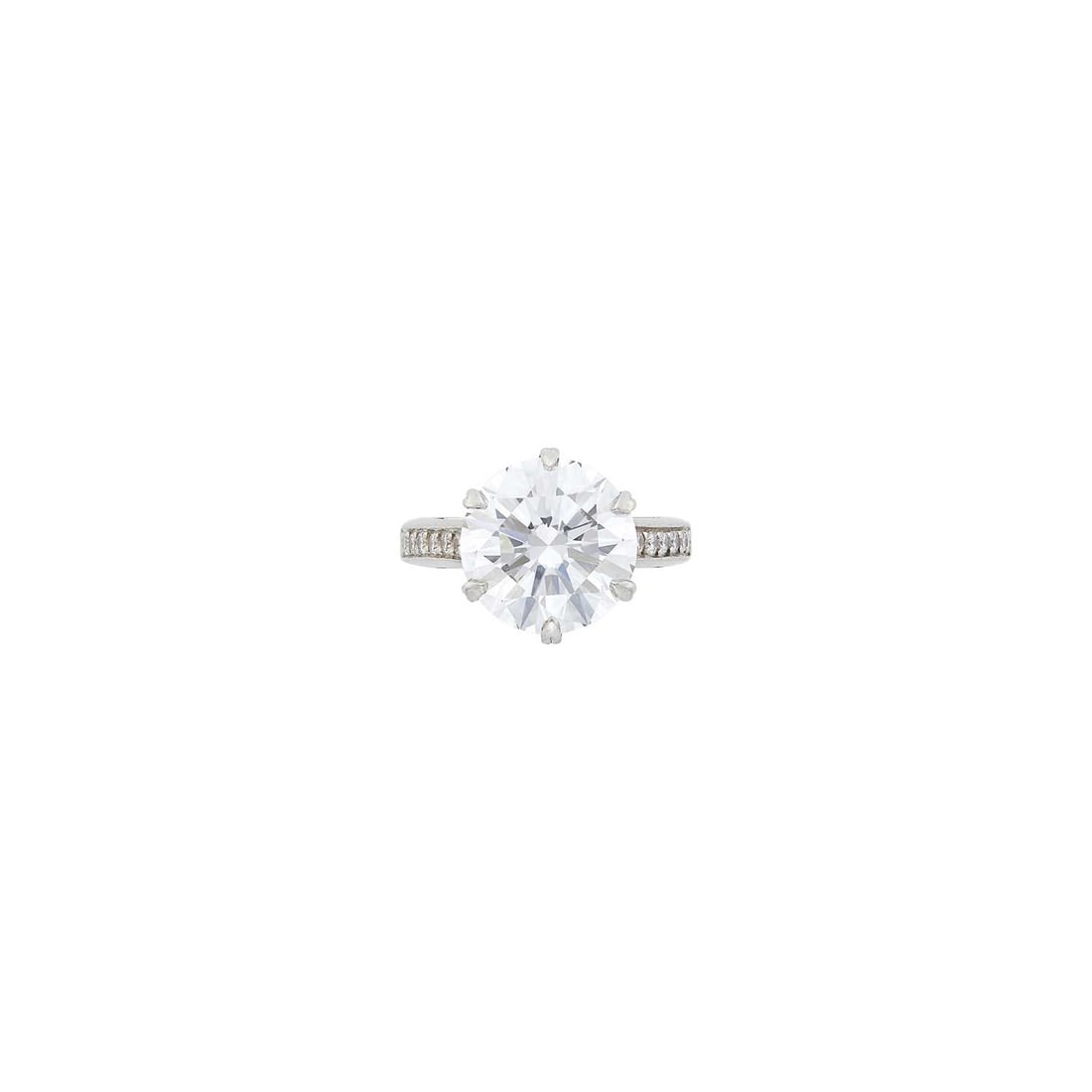 Michael Beaudry Platinum and Diamond Ring: One round diamond weighing 7.01 cts., 12 round diamonds ap. .25 ct., ap. 7.7 dwts. Size 5, with bumpers. With GIA report no. 5234110302 stating G color, VS2 clarity.