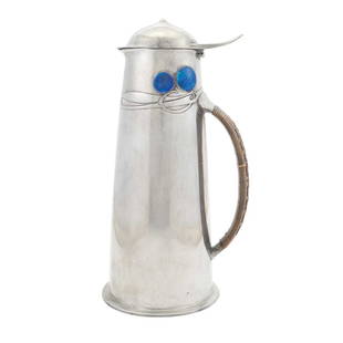 Archibald Knox for Liberty & Co. Pewter and Enamel Tudric Pattern Flagon: Estate / Collection: Property from a Gold Coast Long Island Private Collection The tapering cylindrical body decorated at the top with a Celtic-inspired stylized foliate band, the hinged domed cover w